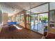 Sun room featuring ample natural light and a game room, leading to the outdoor patio at 8125 Soledad Canyon St, Las Vegas, NV 89131