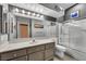Bathroom featuring a vanity, sink, mirror, toilet, and shower at 819 Arrowhead Trl, Henderson, NV 89002