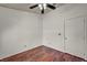 Cozy bedroom featuring hardwood floors and a ceiling fan at 819 Arrowhead Trl, Henderson, NV 89002