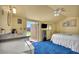 This bedroom features an outdoor entrance, kitchenette area, and comfortable queen bed for a cozy retreat at 819 Arrowhead Trl, Henderson, NV 89002