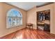 Bedroom with natural light, hardwood floors, a spacious closet, and a small table at 819 Arrowhead Trl, Henderson, NV 89002
