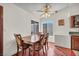 Bright dining area with natural light, seating for six, and views of the backyard at 819 Arrowhead Trl, Henderson, NV 89002