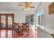 Dining area featuring backyard access, natural light, a ceiling fan, and seating for four at 819 Arrowhead Trl, Henderson, NV 89002