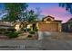Charming single-story home with a well-maintained desert landscape and a spacious two-car garage at 819 Arrowhead Trl, Henderson, NV 89002
