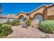 Attractive desert landscaping featuring a bench seating area in front of a single-story home at 819 Arrowhead Trl, Henderson, NV 89002