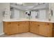 Bathroom with double sinks, large mirrors, and wood cabinets at 8255 One Las Vegas Blvd # 504, Las Vegas, NV 89123