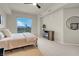 Relaxing bedroom with soft carpet, a ceiling fan, and a sliding glass door leading to a balcony at 8255 One Las Vegas Blvd # 504, Las Vegas, NV 89123