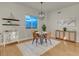 Cozy dining area with modern light fixture, wood floors, and view from the window at 8255 One Las Vegas Blvd # 504, Las Vegas, NV 89123