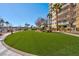 Lush green space with manicured landscaping provides a tranquil outdoor retreat with seating at 8255 One Las Vegas Blvd # 504, Las Vegas, NV 89123