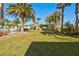 Expansive green space with palm trees and lush landscaping and a barbeque, a serene and inviting atmosphere at 8255 One Las Vegas Blvd # 504, Las Vegas, NV 89123