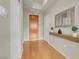 Hallway features wood floors, a decorative mirror, and modern finishes at 8255 One Las Vegas Blvd # 504, Las Vegas, NV 89123