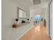 Hallway view of dining area, modern light fixture, and wood floors at 8255 One Las Vegas Blvd # 504, Las Vegas, NV 89123