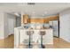 Bright open kitchen boasts stainless steel appliances, granite countertops, and breakfast bar seating at 8255 One Las Vegas Blvd # 504, Las Vegas, NV 89123