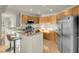 Well-lit kitchen features stainless steel appliances, granite countertops, and breakfast bar at 8255 One Las Vegas Blvd # 504, Las Vegas, NV 89123