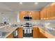 Modern kitchen includes stainless steel appliances, granite countertops, and ample wood cabinetry at 8255 One Las Vegas Blvd # 504, Las Vegas, NV 89123