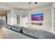 The living room offers a comfortable gray sofa, wood floors, and a large wall-mounted television at 8255 One Las Vegas Blvd # 504, Las Vegas, NV 89123