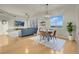 Bright living room featuring a ceiling fan, flatscreen TV, wood floors, and dining area at 8255 One Las Vegas Blvd # 504, Las Vegas, NV 89123