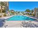Inviting pool area with clear blue water, lounge chairs, and palm trees for a relaxing resort-style experience at 8255 One Las Vegas Blvd # 504, Las Vegas, NV 89123