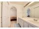 Bathroom has dual sinks with vanity and cabinets offering storage space at 8370 Lost Lake Ct, Las Vegas, NV 89147