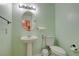 Bathroom with a pedestal sink, toilet and fixtures at 8370 Lost Lake Ct, Las Vegas, NV 89147