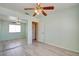 Bright bedroom features a ceiling fan, wood-look flooring, a mirrored closet, and neutral paint to add a personal touch at 8370 Lost Lake Ct, Las Vegas, NV 89147