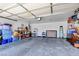 Spacious two-car garage featuring ample storage space for an organized and functional workspace at 8370 Lost Lake Ct, Las Vegas, NV 89147