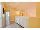 Hallway featuring white built-in cabinets and wood-look flooring at 8370 Lost Lake Ct, Las Vegas, NV 89147