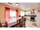 Bright eat-in kitchen featuring white cabinets and stainless steel appliances at 8370 Lost Lake Ct, Las Vegas, NV 89147