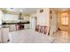 Spacious eat-in kitchen with white cabinets, stainless appliances and tile floor at 8370 Lost Lake Ct, Las Vegas, NV 89147