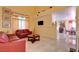 Bright living room showcasing tile flooring and comfortable seating at 8370 Lost Lake Ct, Las Vegas, NV 89147