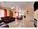Open-concept living space with kitchen, living room and tile flooring at 8370 Lost Lake Ct, Las Vegas, NV 89147