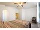 Spacious main bedroom with vaulted ceilings and an adjacent bathroom, perfect for relaxation and privacy at 8370 Lost Lake Ct, Las Vegas, NV 89147
