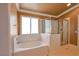 Bright bathroom showcasing a separate tub and a glass-enclosed shower at 9923 Sierra Canyon Way, Las Vegas, NV 89147