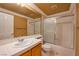 Hall bath featuring a shower over tub, vanity with mirror, and tile flooring at 9923 Sierra Canyon Way, Las Vegas, NV 89147