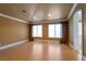 Bedroom with wood floors, crown moulding, and natural light offers a serene ambiance at 9923 Sierra Canyon Way, Las Vegas, NV 89147