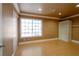 Bedroom featuring recessed lighting, light-colored walls, a large window, and light-colored wood floors at 9923 Sierra Canyon Way, Las Vegas, NV 89147