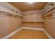 Spacious walk-in closet with shelves and rods, ready for organizing your wardrobe at 9923 Sierra Canyon Way, Las Vegas, NV 89147