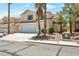 Charming two-story home featuring a three car garage and desert landscaping in a suburban neighborhood at 9923 Sierra Canyon Way, Las Vegas, NV 89147