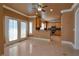 Open kitchen with granite countertops and breakfast bar offers ample space for cooking and gathering at 9923 Sierra Canyon Way, Las Vegas, NV 89147