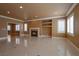 Spacious living area with fireplace and tile flooring offers a seamless blend of comfort and style at 9923 Sierra Canyon Way, Las Vegas, NV 89147