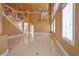 Open floor plan with large windows and tile flooring with staircase leading to the second floor at 9923 Sierra Canyon Way, Las Vegas, NV 89147