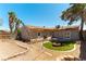 Property backyard including fire pit, patio, pergola, and tropical trees at 100 Walker Way, Boulder City, NV 89005
