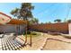 Backyard area with fire pit, pergola, patio, and landscape areas at 100 Walker Way, Boulder City, NV 89005