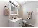 Well-lit bathroom with a vanity, framed mirror, and a shower with neutral accents at 100 Walker Way, Boulder City, NV 89005