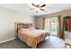 Serene bedroom with a fan and access to the outdoor patio through French doors at 100 Walker Way, Boulder City, NV 89005