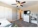 Comfortable bedroom with ceiling fan, closet, and view into the hallway at 100 Walker Way, Boulder City, NV 89005