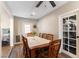 Bright dining room with hardwood floors and a wooden table with seating for six at 100 Walker Way, Boulder City, NV 89005