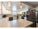 Well-lit kitchen featuring stainless steel appliances, lots of cabinets, and stone countertops at 100 Walker Way, Boulder City, NV 89005
