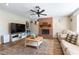 Inviting living room featuring a brick fireplace and hardwood floors, great for entertaining at 100 Walker Way, Boulder City, NV 89005