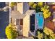 Aerial view of a house with a pool and jacuzzi combo in the backyard at 10002 Trapper Mountain St, Las Vegas, NV 89178